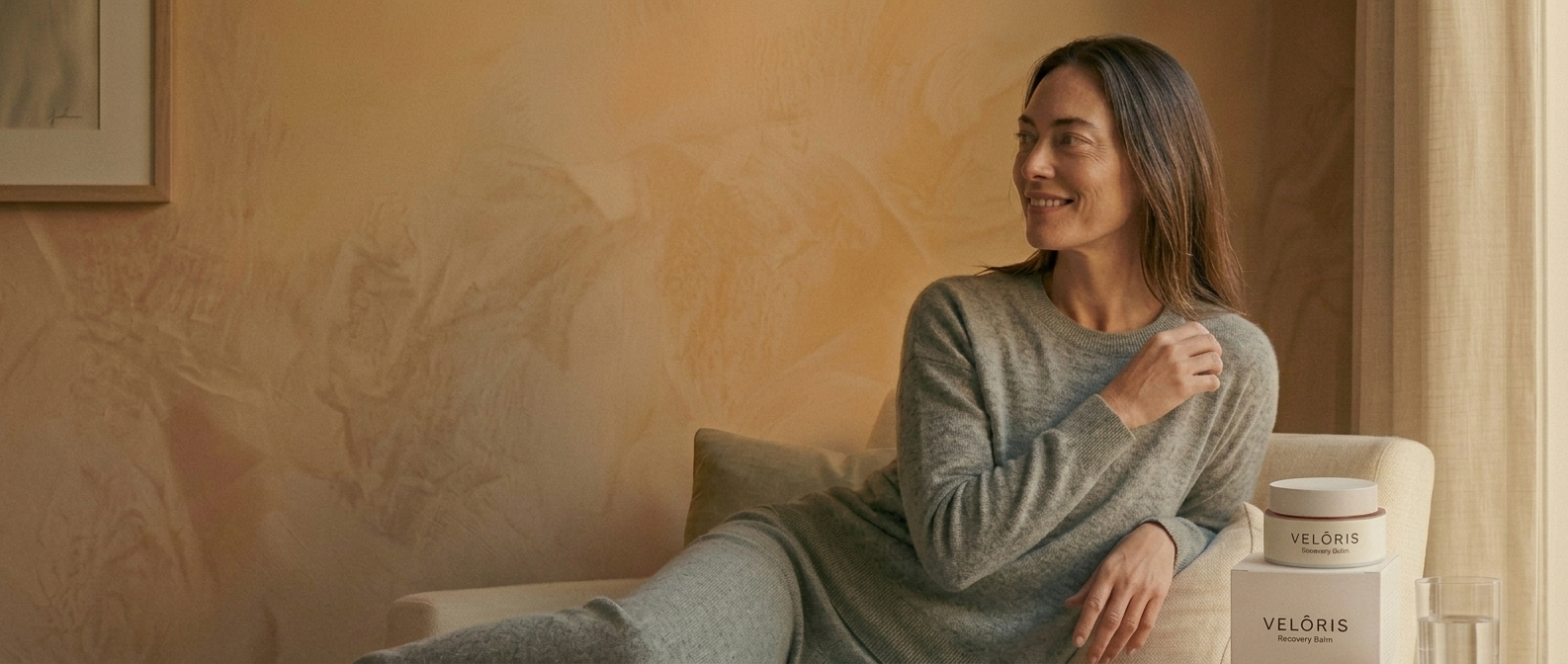 Woman relaxing next to Veloris Recovery Balm